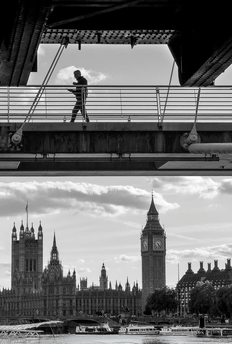 Lone figure silhouetted crossing Blackfriars Railway Bridge above Big Ben and the Houses of Parliament on the Thames, split-frame black and white fine art street photography print