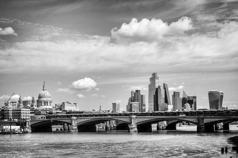 Panoramic black and white fine art print of Blackfriars Bridge spanning the Thames with St Paul's Cathedral dome to the left and the modern City of London skyline including the Walkie Talkie and Cheesegrater to the right