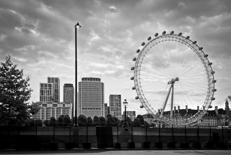London Eye Ferris wheel on the South Bank with County Hall beside it and the Thames in the foreground, black and white fine art photography print